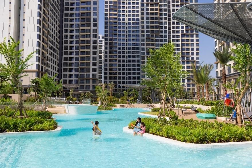 People in a pool with trees and buildings in the backgroundAI-generated content may be incorrect.