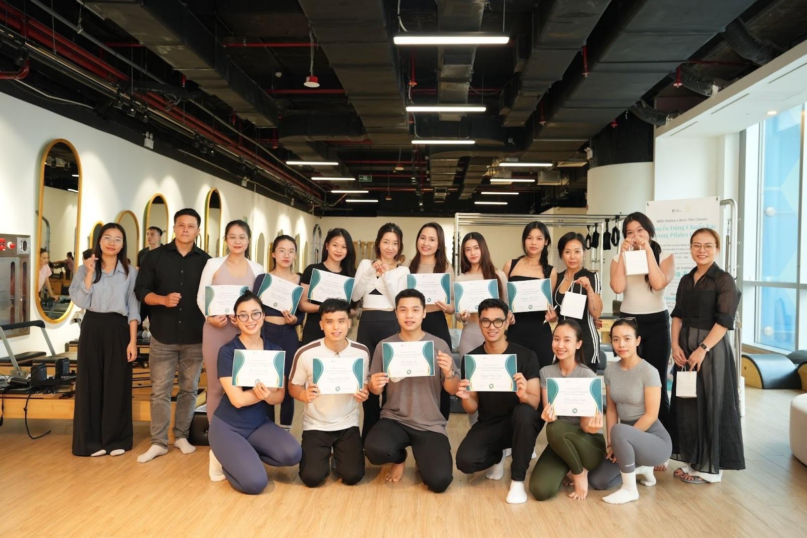 A group of people holding up signsAI-generated content may be incorrect.