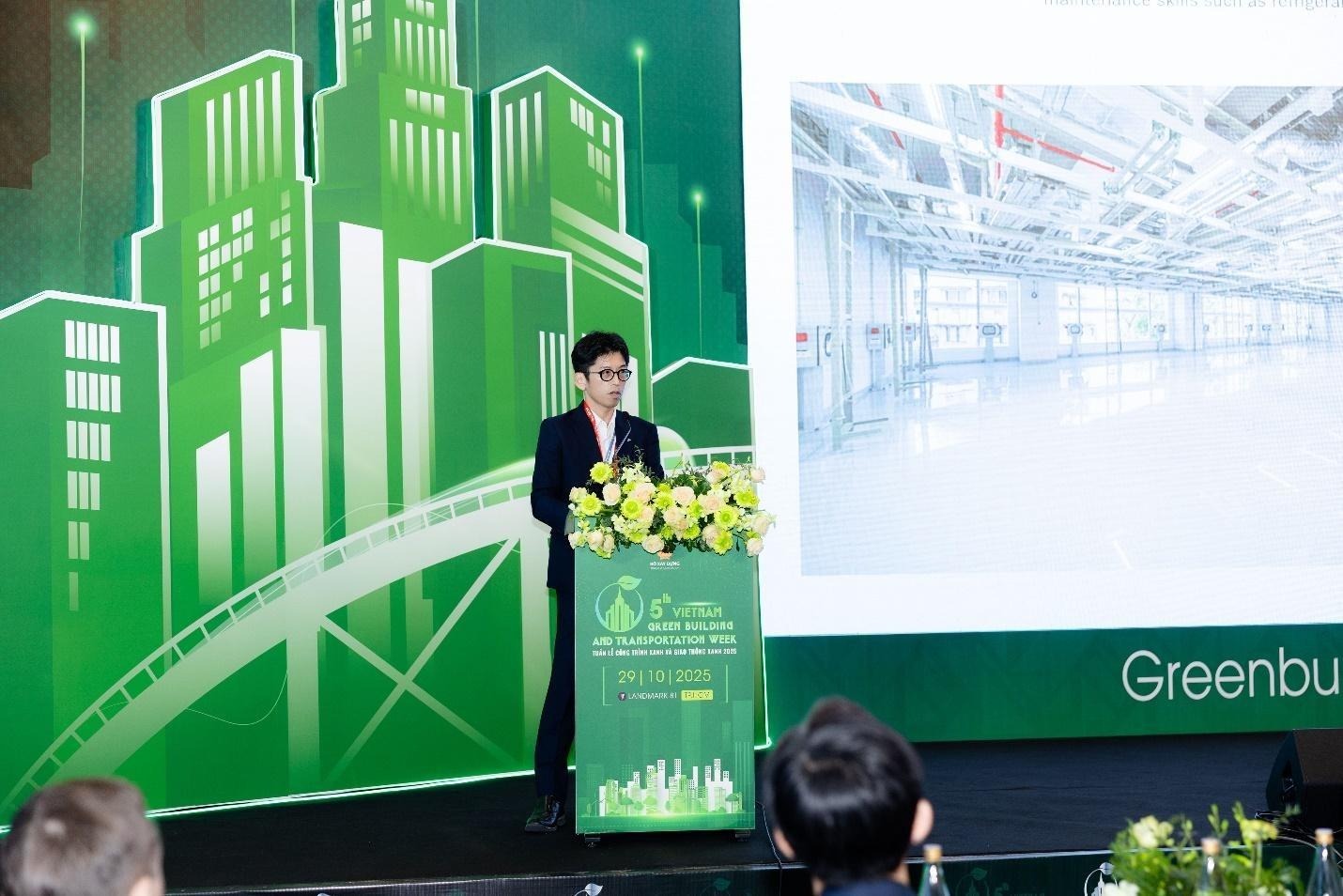 A person standing at a podium with flowersAI-generated content may be incorrect.