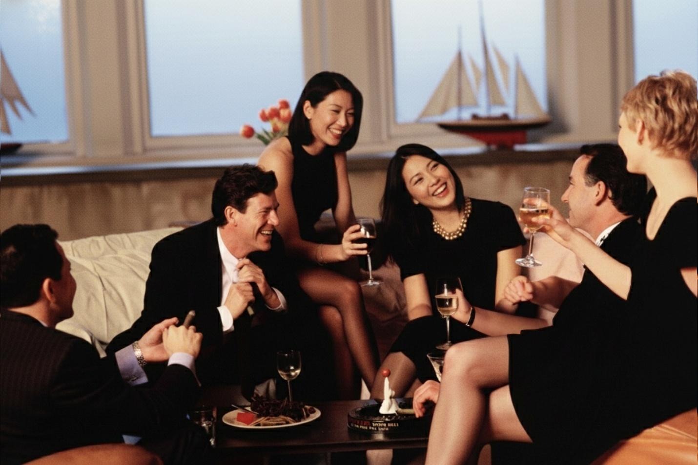 A group of people sitting on a couchAI-generated content may be incorrect.