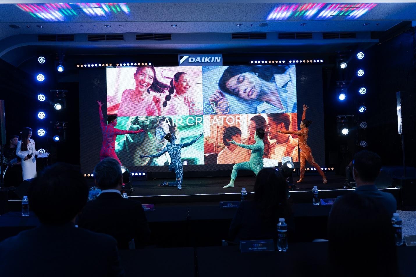 A group of people on a stageDescription automatically generated