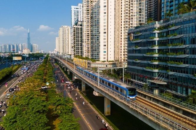 A train on a bridge over a road with buildings
AI-generated content may be incorrect.
